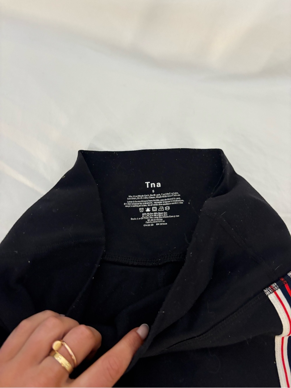 TNA Black Pullover with Red and White Trim